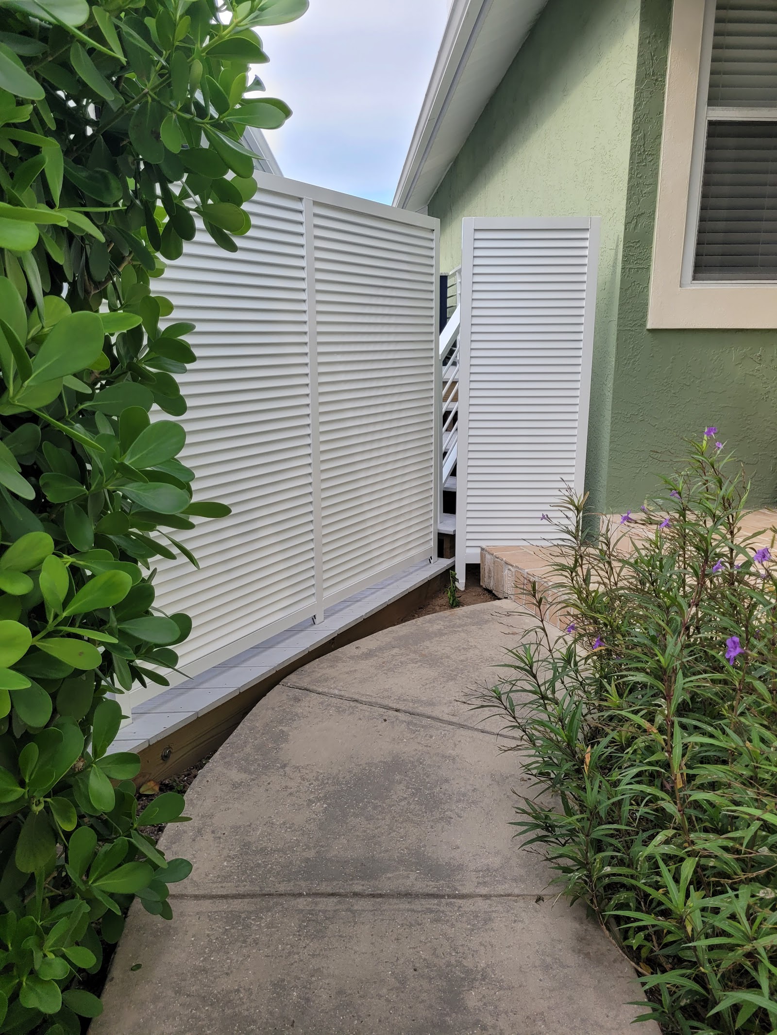 Aluminum Bahama Louver fence installation in Tampa, FL — Vilo Fence