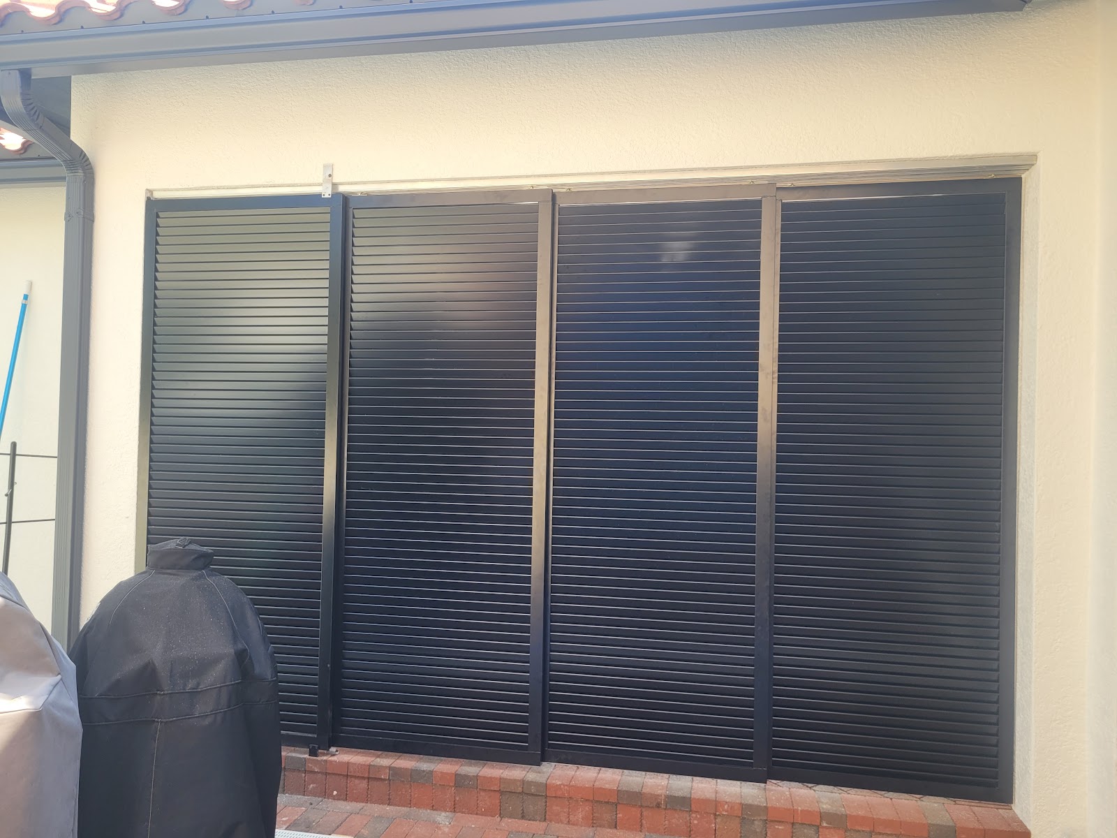 Aluminum Bahama Louver fence installation in Tampa, FL — Vilo Fence