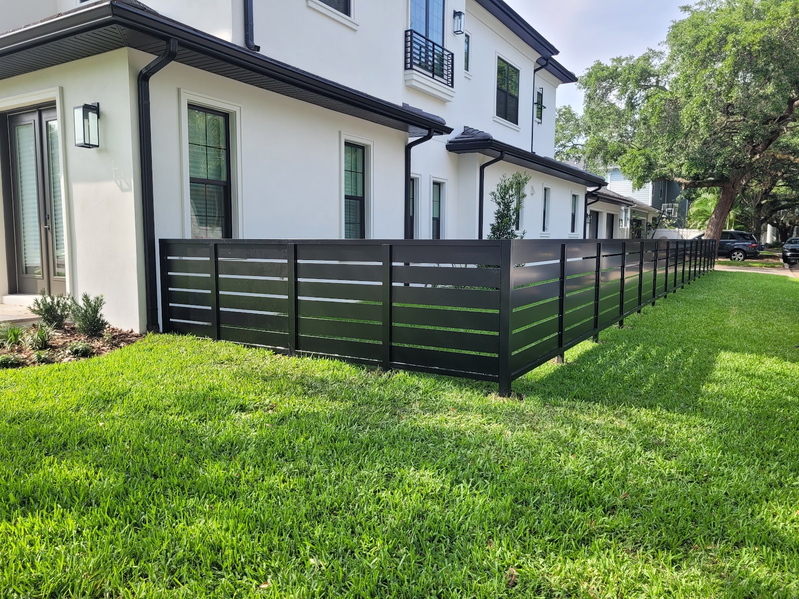 Aluminum Flat Bar Horizontal fence installation in Tampa, FL — Vilo Fence