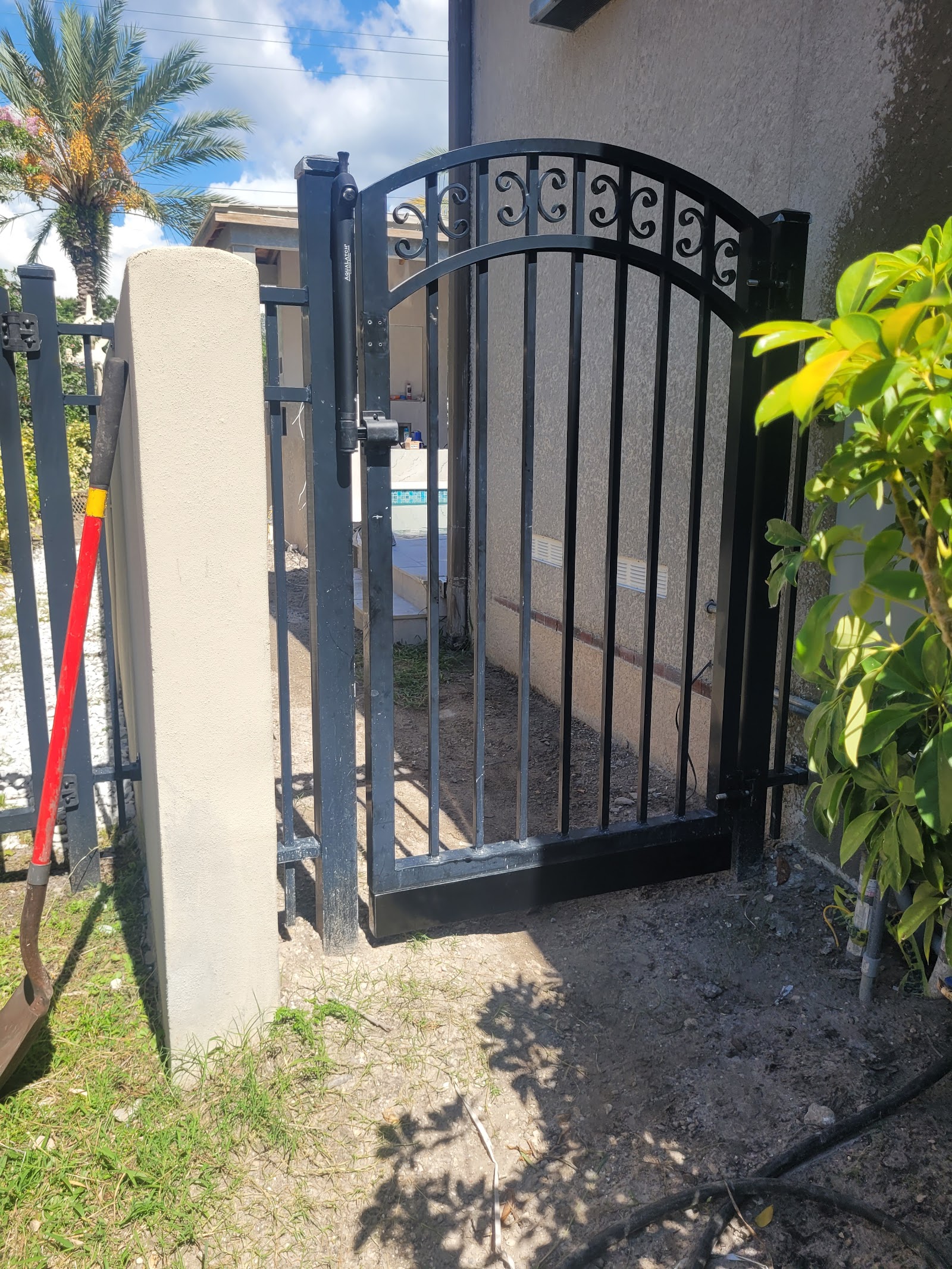 Aluminum Flat Top + Scrolls fence installation in Tampa, FL — Vilo Fence