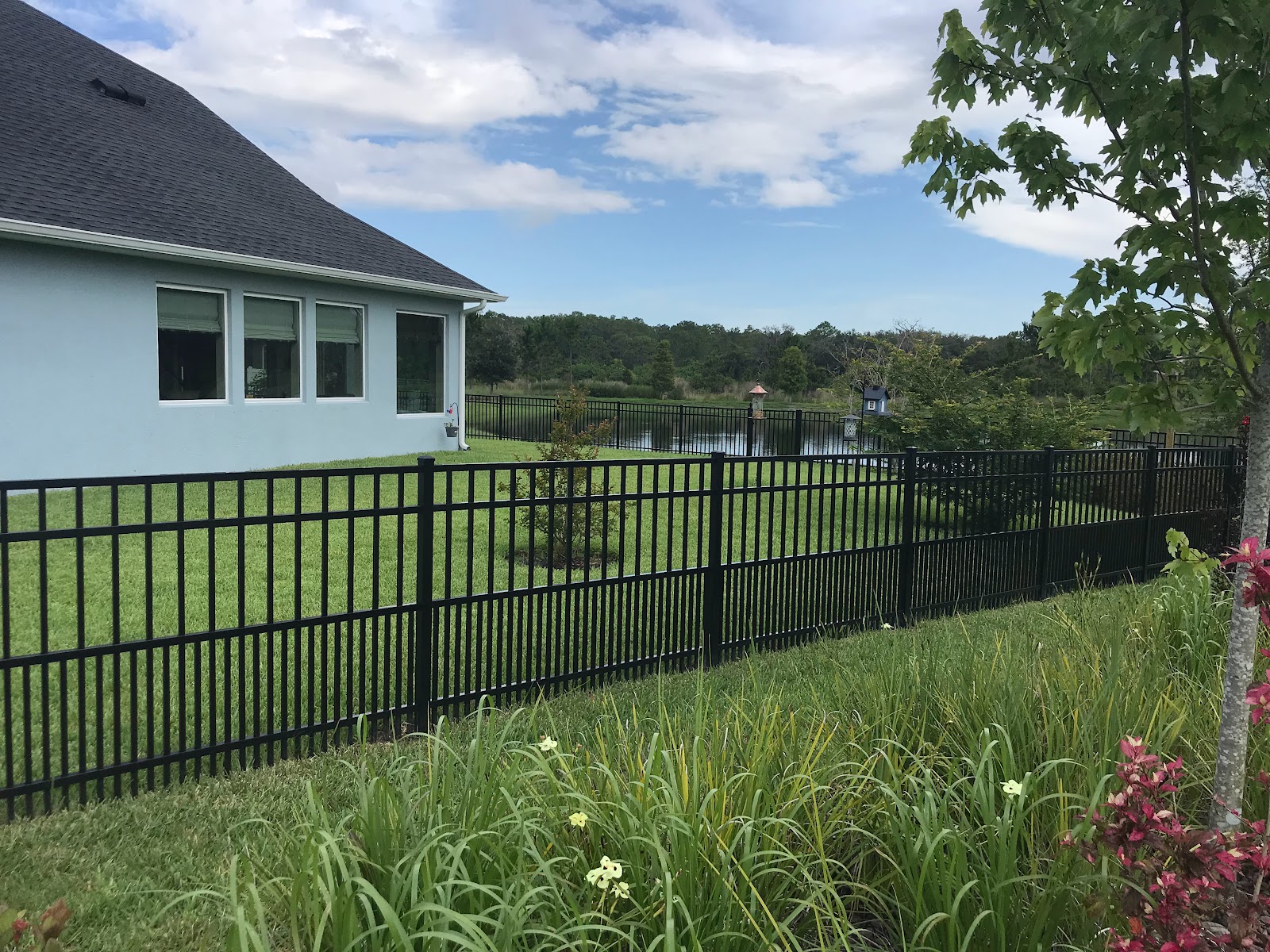 Aluminum Puppy Picket fence installation in Tampa, FL — Vilo Fence