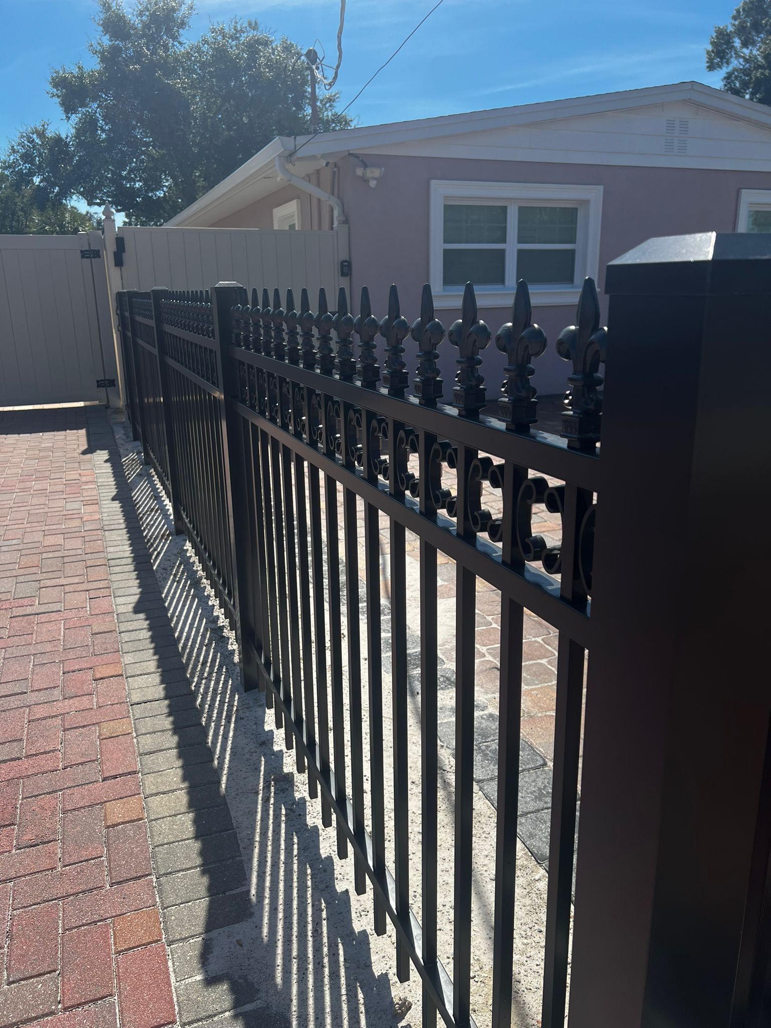 Aluminum Spear Finials + Scrolls fence installation in Tampa, FL — Vilo Fence