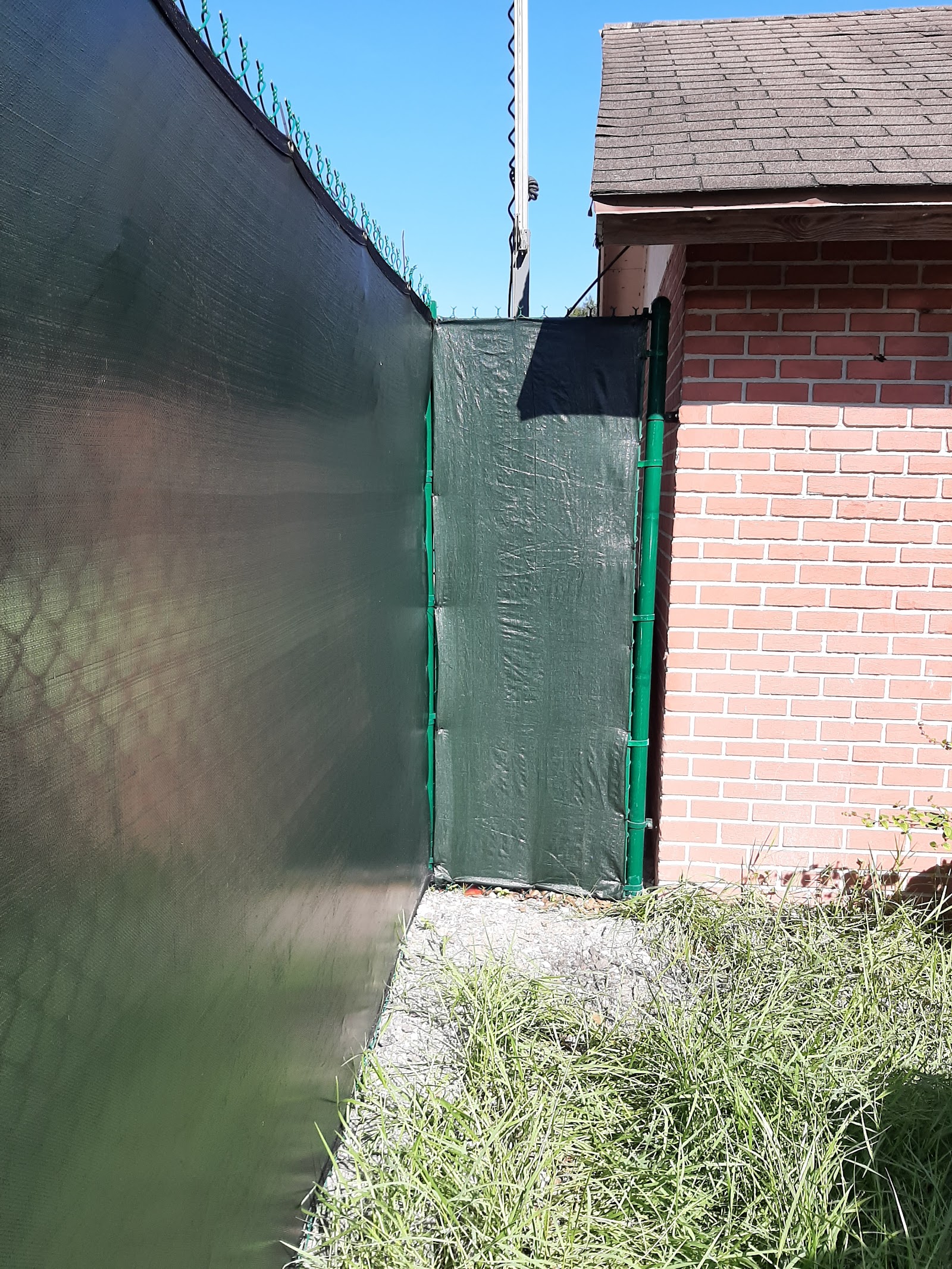 Chain-Link Windscreen fence installation in Tampa, FL — Vilo Fence