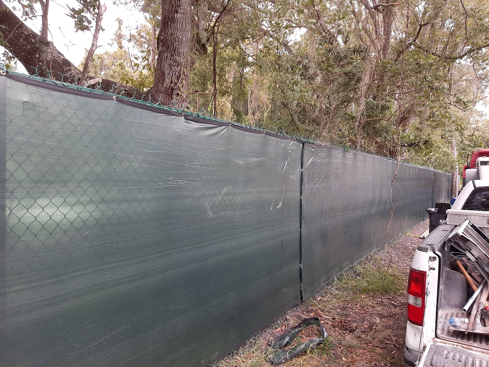 Chain-Link Windscreen fence installation in Tampa, FL — Vilo Fence
