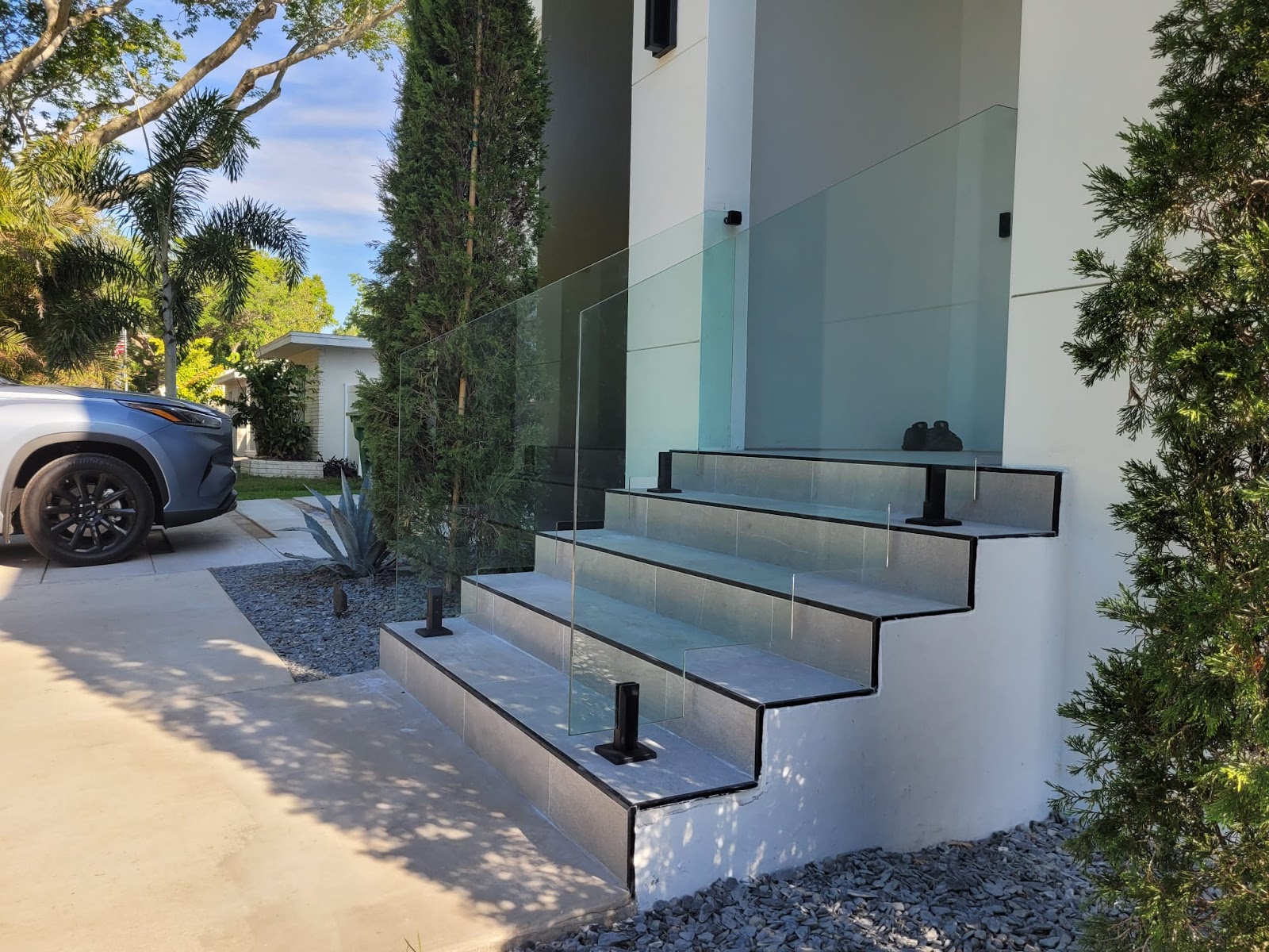 Handrail Glass fence installation in Tampa, FL — Vilo Fence