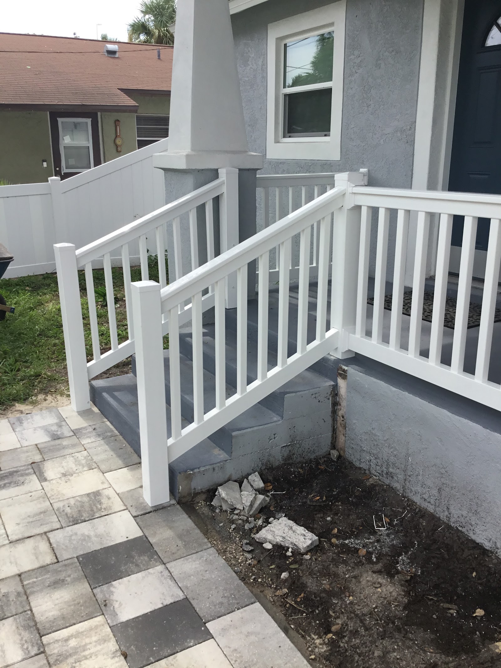 Handrail PVC fence installation in Tampa, FL — Vilo Fence