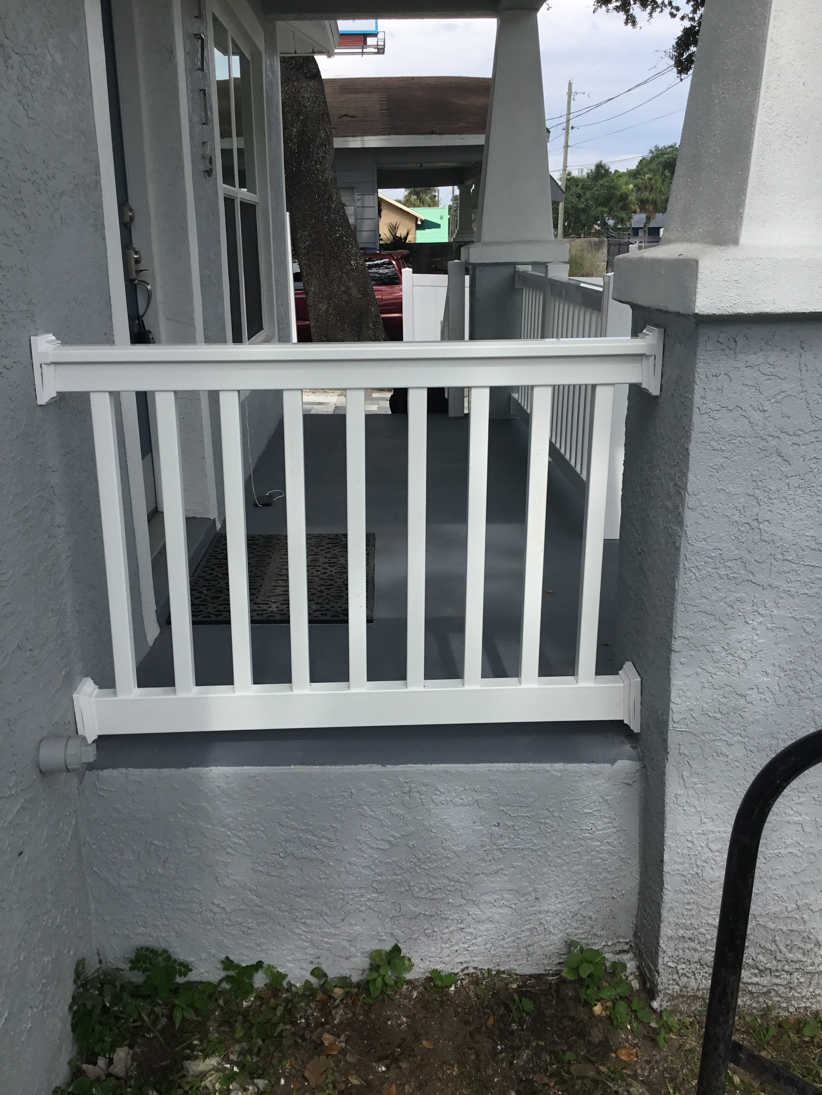 Handrail PVC fence installation in Tampa, FL — Vilo Fence