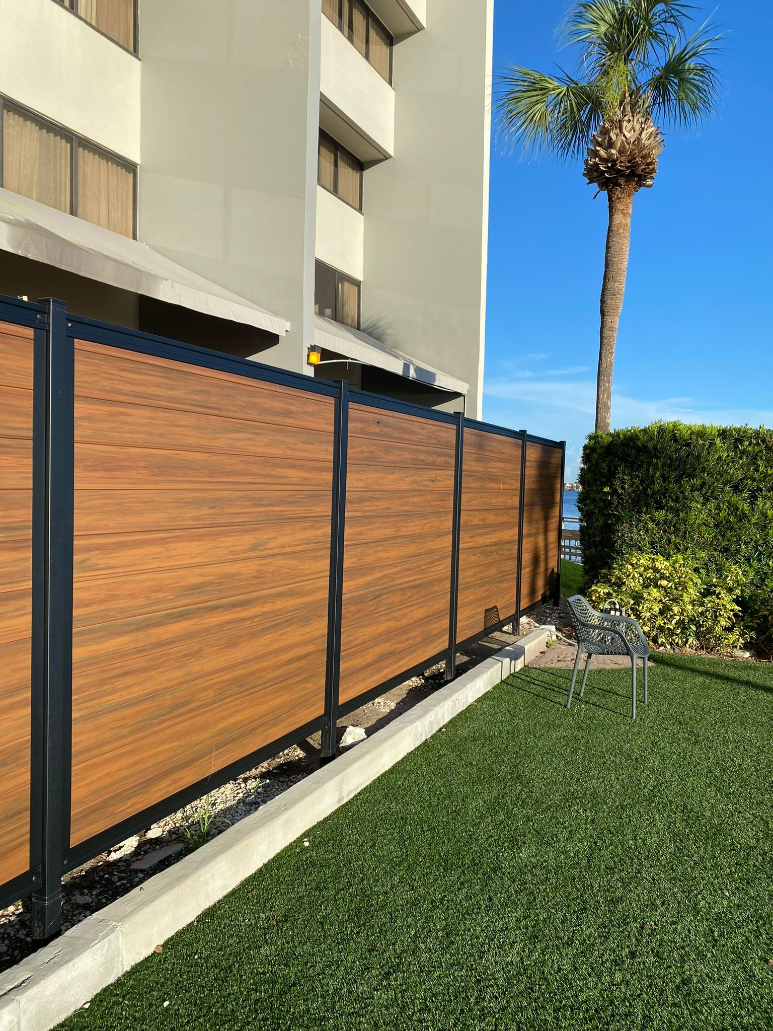 PVC Privacy Horizontal Metal Frame + Mocha fence installation in Tampa, FL — Vilo Fence