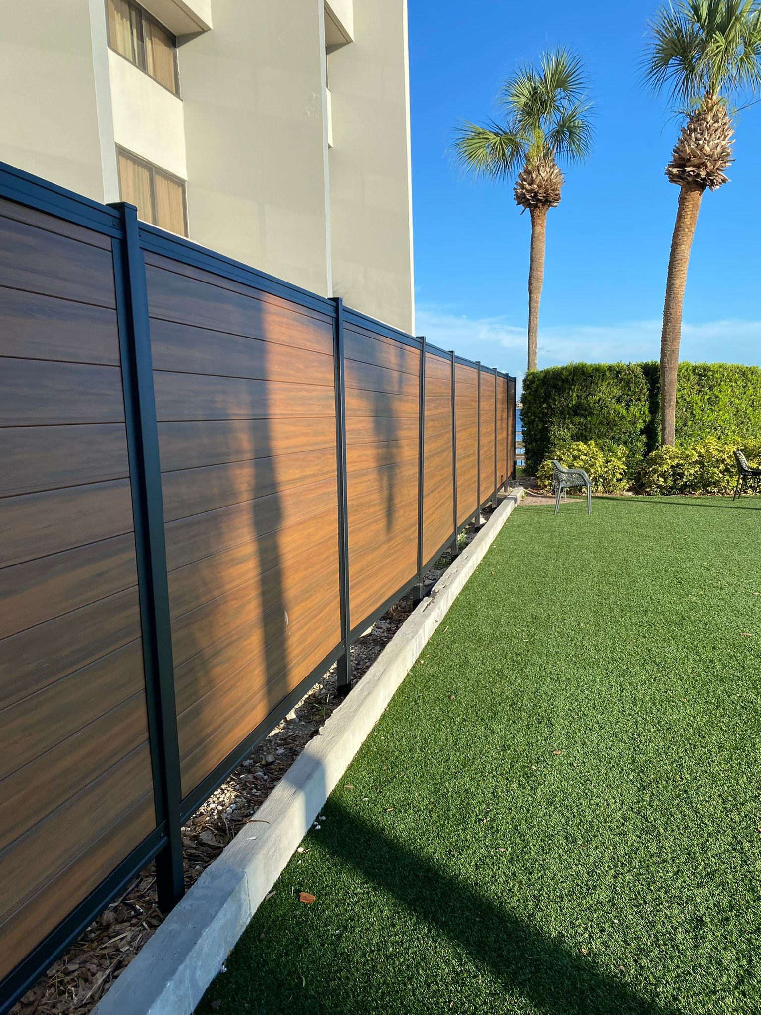 PVC Privacy Horizontal Metal Frame + Mocha fence installation in Tampa, FL — Vilo Fence