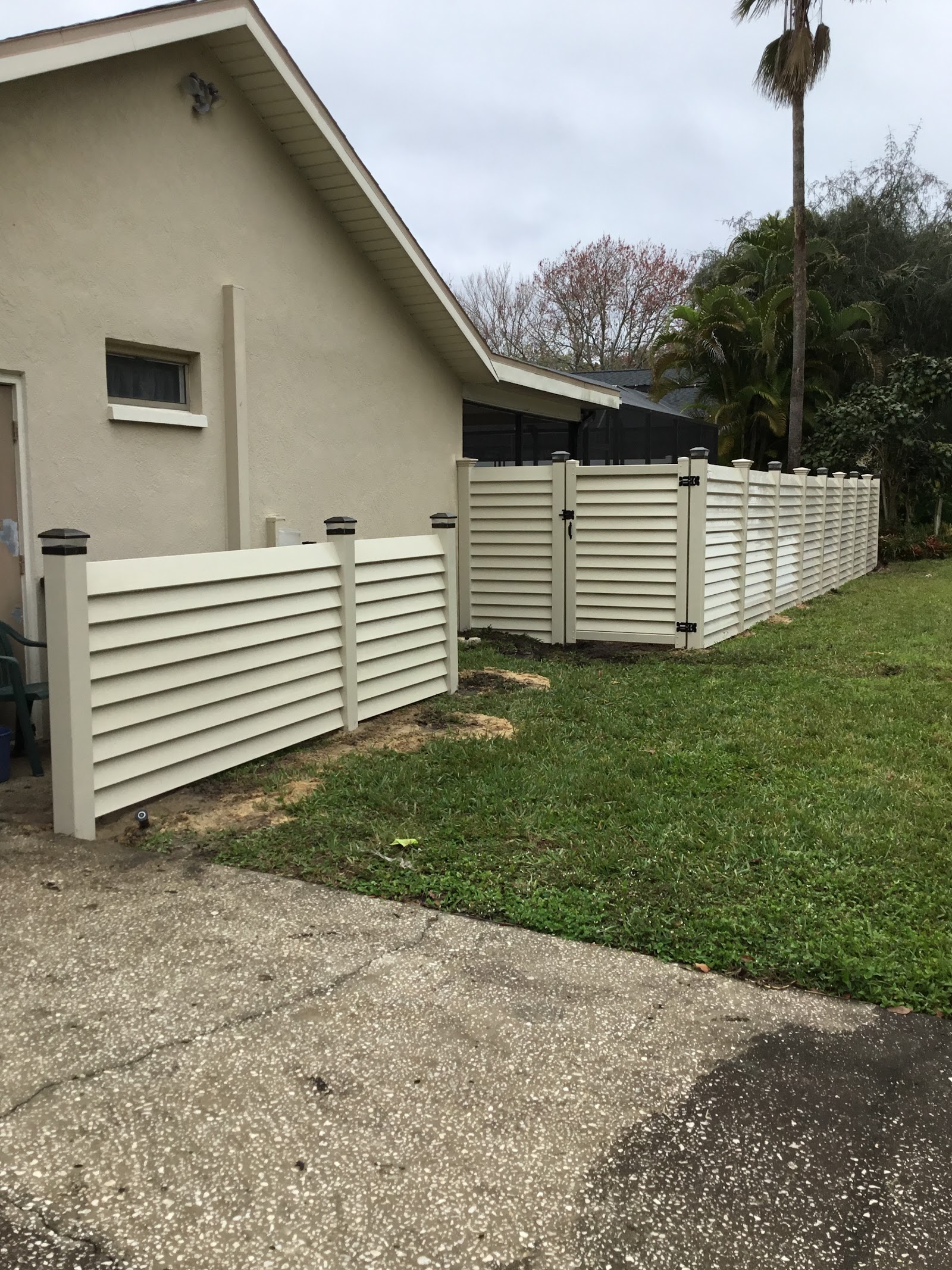 PVC Privacy Louvered Tan fence installation in Tampa, FL — Vilo Fence