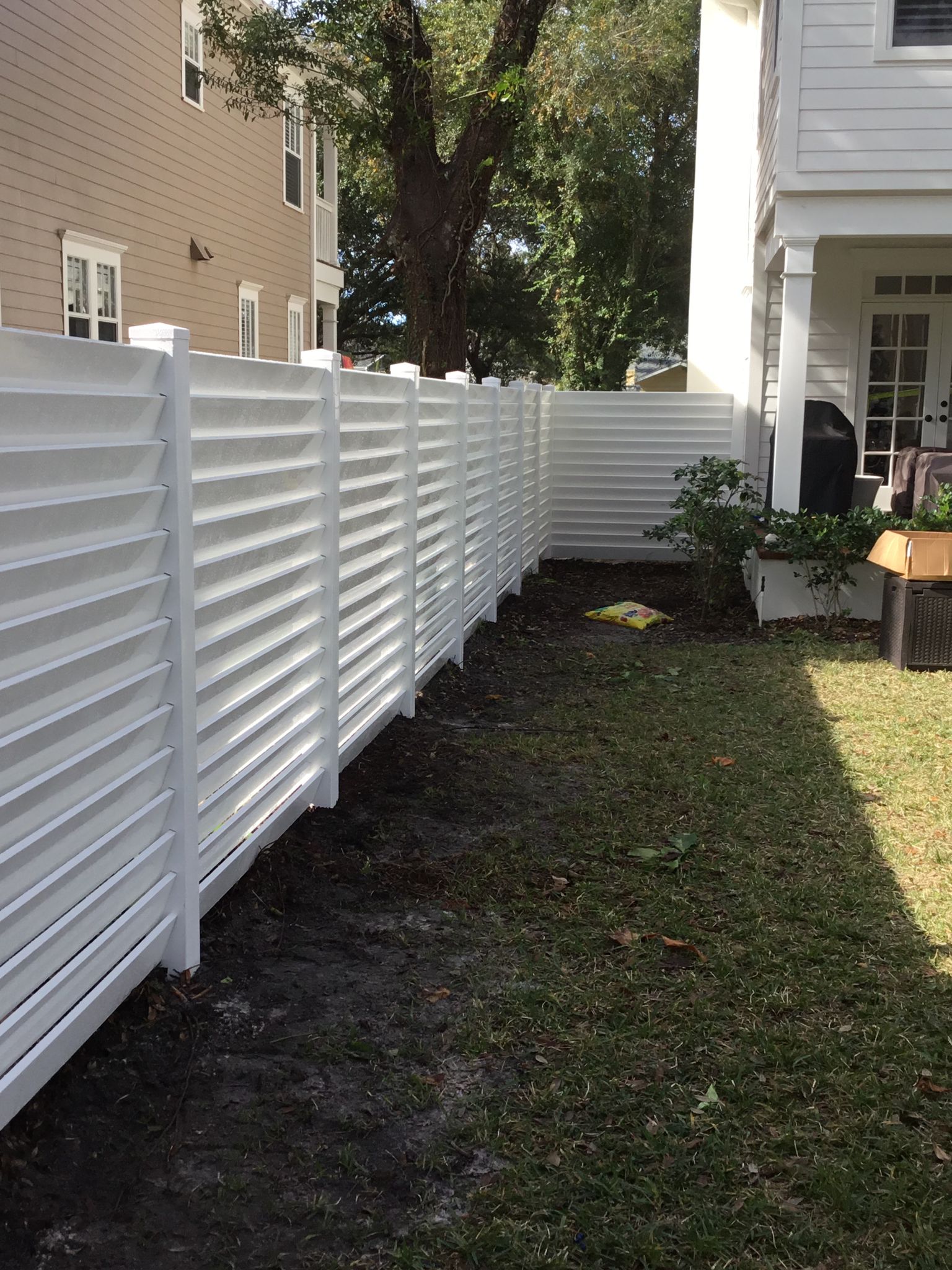 PVC Privacy Louvered White fence installation in Tampa, FL — Vilo Fence