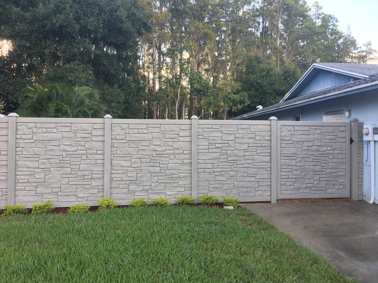 PVC Privacy Simtek Ecostone fence installation in Tampa, FL — Vilo Fence