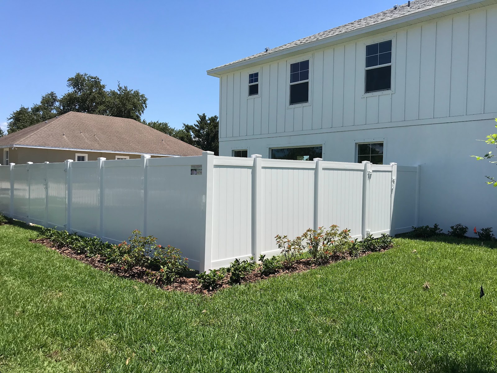 White PVC privacy fence panels manufactured by Vilo Fence Tampa