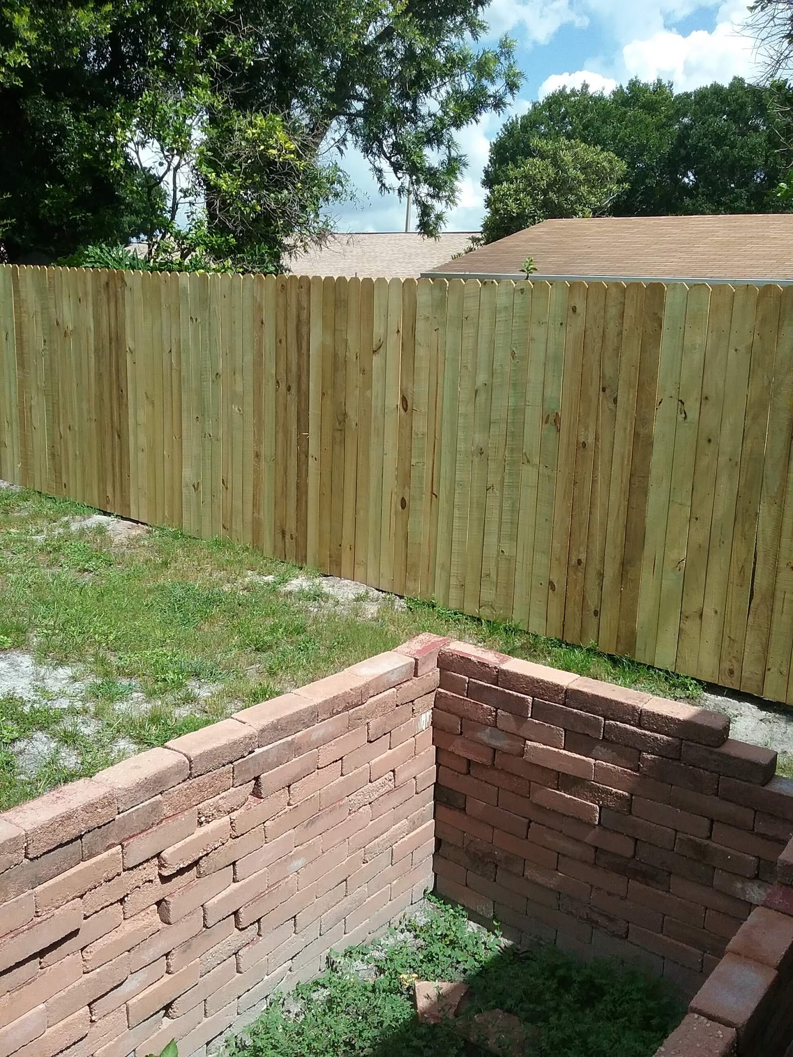 Wood Stockade fence installation in Tampa, FL — Vilo Fence