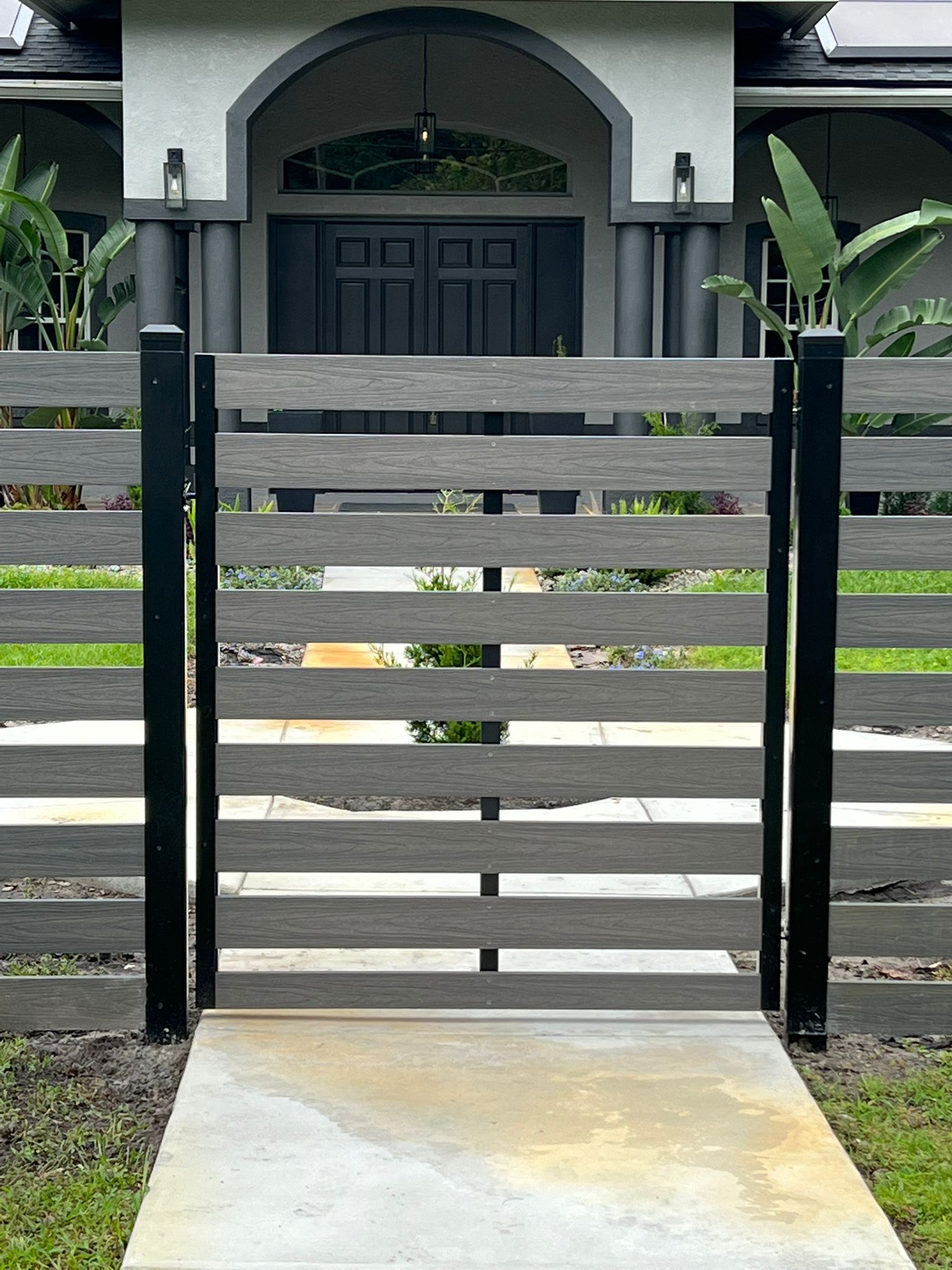 Wood Synthetic fence installation in Tampa, FL — Vilo Fence