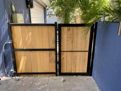 Wood Privacy Vertical Metal Frame fence installation in Tampa, FL — Vilo Fence