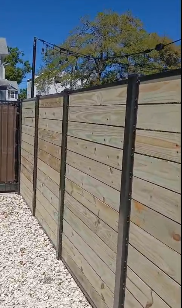 Wood Privacy Horizontal Metal Frame fence installation in Tampa, FL — Vilo Fence